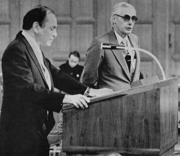 Mr. Macmichael, right, in 1985, testifying at the World Court in the Netherlands that the United States had put into effect a C.I.A. plan to invade Nicaragua. Abrams Chayes, left, a Harvard law professor, questioned him as a member of the Nicaraguan legal team that had sued the U.S.