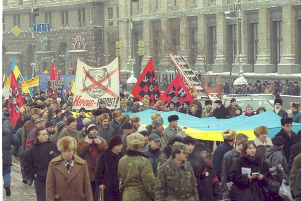 A crowd of people holding flags

Description automatically generated with medium confidence