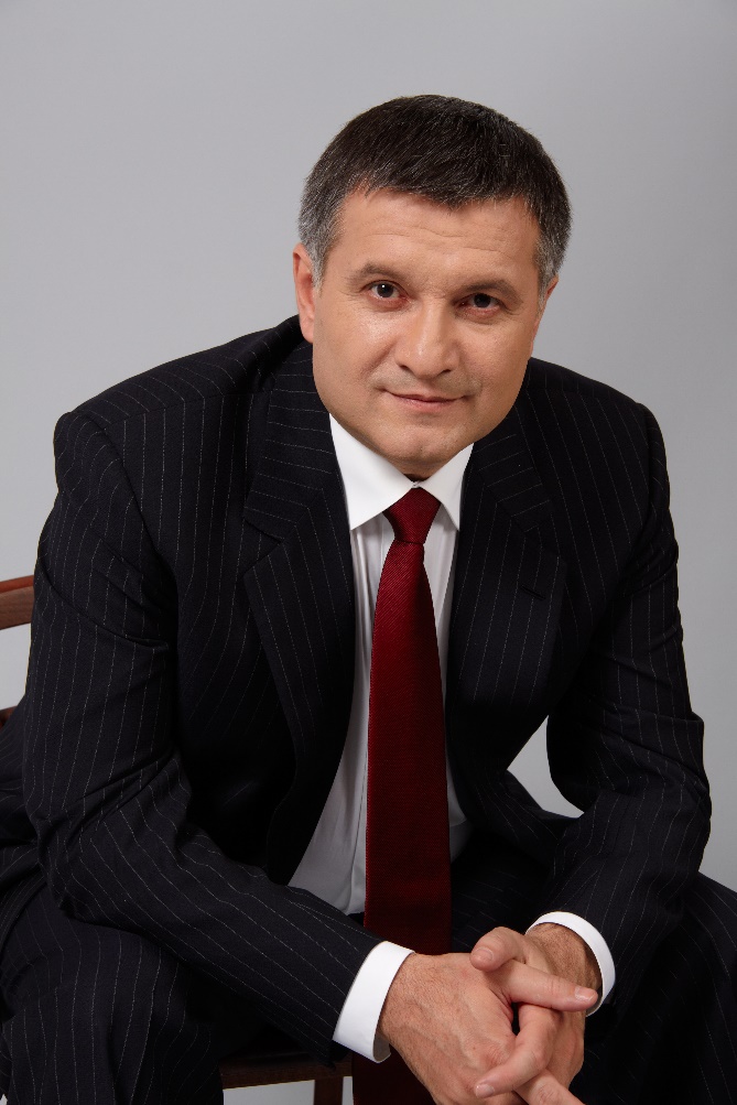 A person in a suit and tie

Description automatically generated with medium confidence