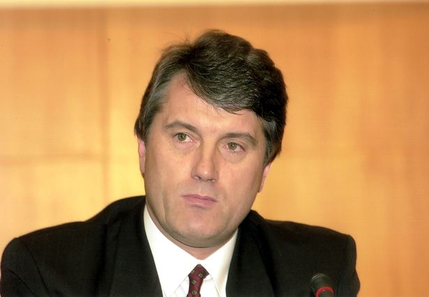 A person in a suit

Description automatically generated with medium confidence