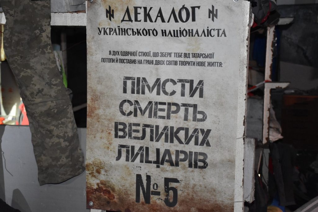 A picture containing text, sign Description automatically generated