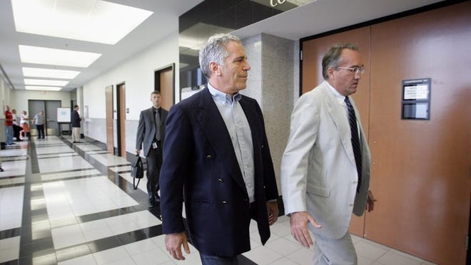 Jeffrey Epstein (left) walks to a Palm Beach County courtroom on June 30, 2008, with attorney Guy Lewis, where he would plead guilty to two prostitution-related charges. [UMA SANGHVI/PALMBEACHPOST.COM]