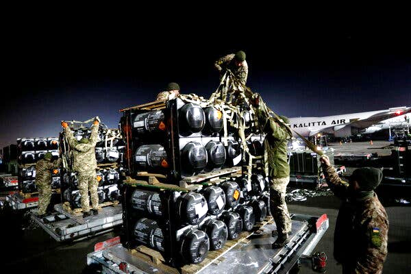 Ukrainian service members unpacking Javelin anti-tank missiles in Kyiv in February. The missiles were part of the U.S. military support package.