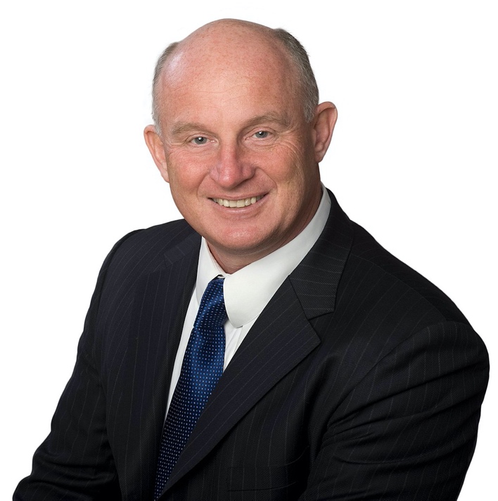 A person in a suit smiling

Description automatically generated with medium confidence