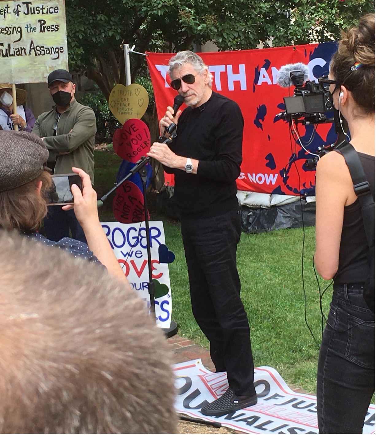 A picture containing person, outdoor, mammal, people
Description automatically generated