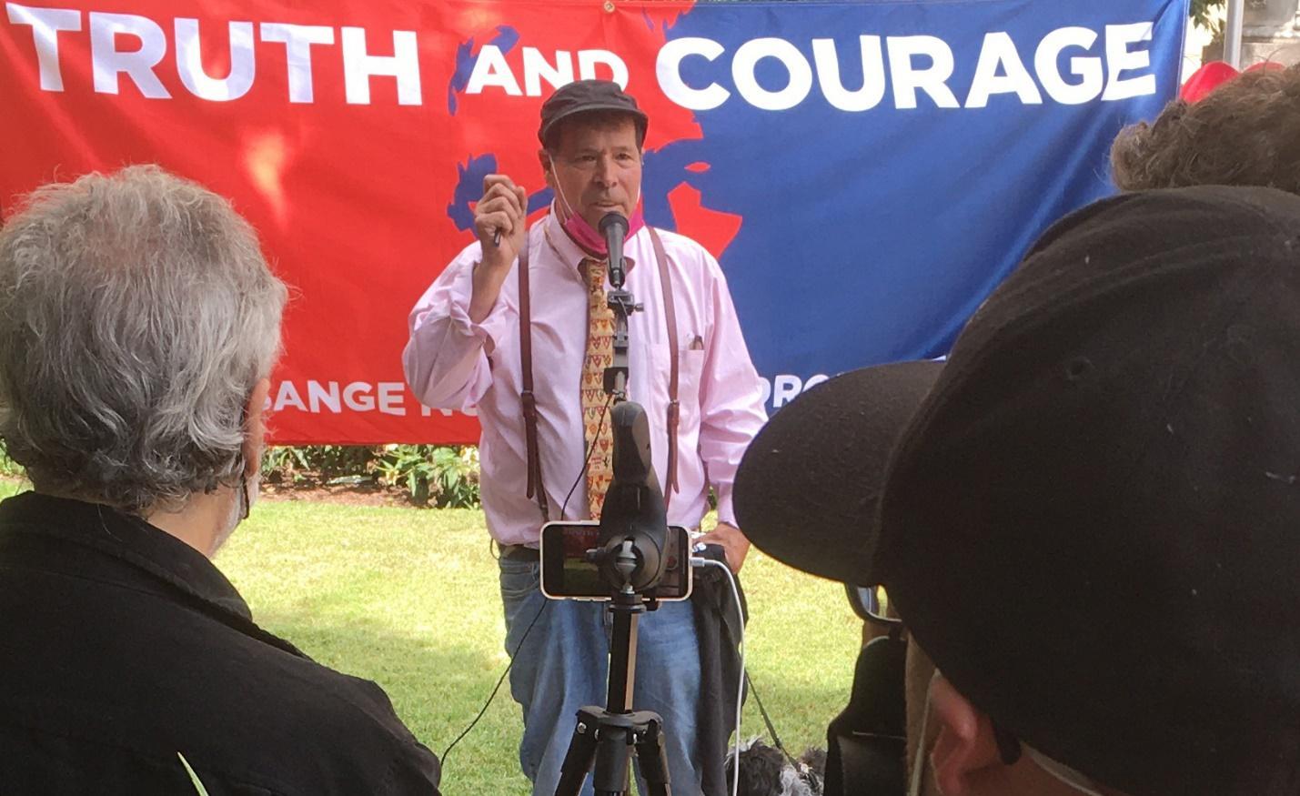 A picture containing text, person, outdoor, person
Description automatically generated