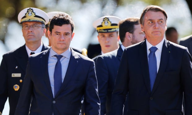 President Jair Bolsonaro and the justice minister, Sérgio Moro, arrive at a ceremony of the 154th anniversary of the Riachuelo naval battle at the marine corps headquarters in Brasília on Tuesday.