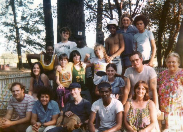 A group of people posing for a photo
Description automatically generated