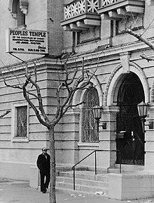 A person standing next to a tree
Description automatically generated with medium confidence