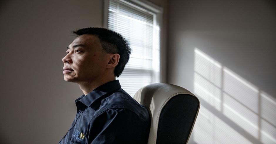 Applied Physicist Xin Zhao sits for a photograph at his home office in North Potomac, Maryland, on June 15.