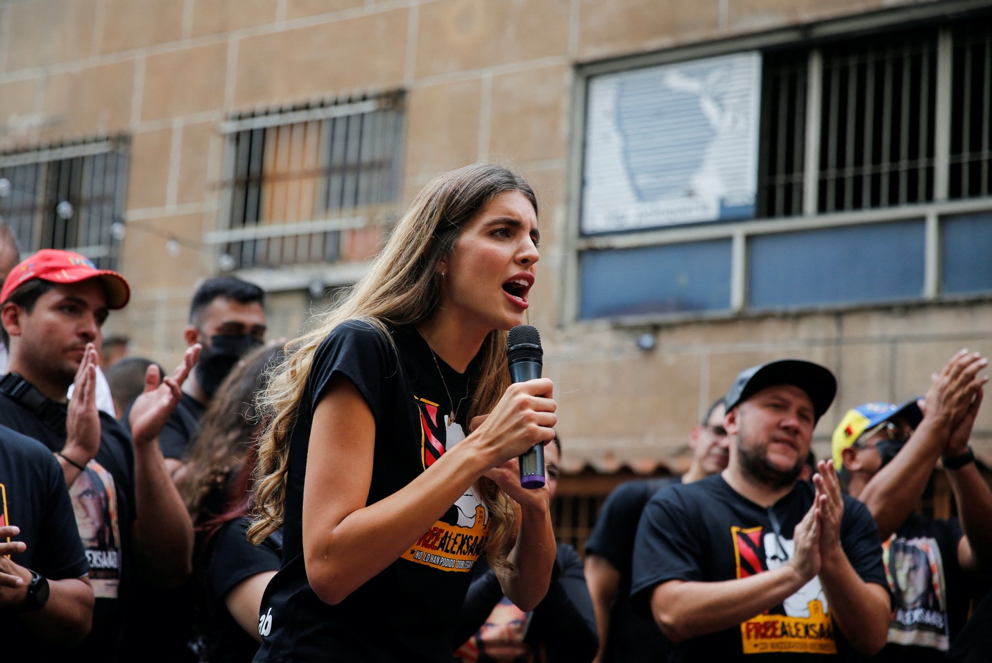Camilla Fabri, wife of Alex Saab, a Colombian businessman with Venezuelan ties who was extradited to the U.S. on charges of money laundering, speaks to supporters during a demonstration calling for his release, in Caracas, Venezuela April 4, 2022. REUTERS/Leonardo Fernandez Viloria