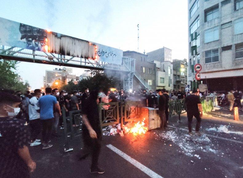 Iranian demonstrators burn rubbish for Mahsa Amini