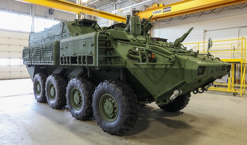A military vehicle in a warehouse

Description automatically generated with low confidence