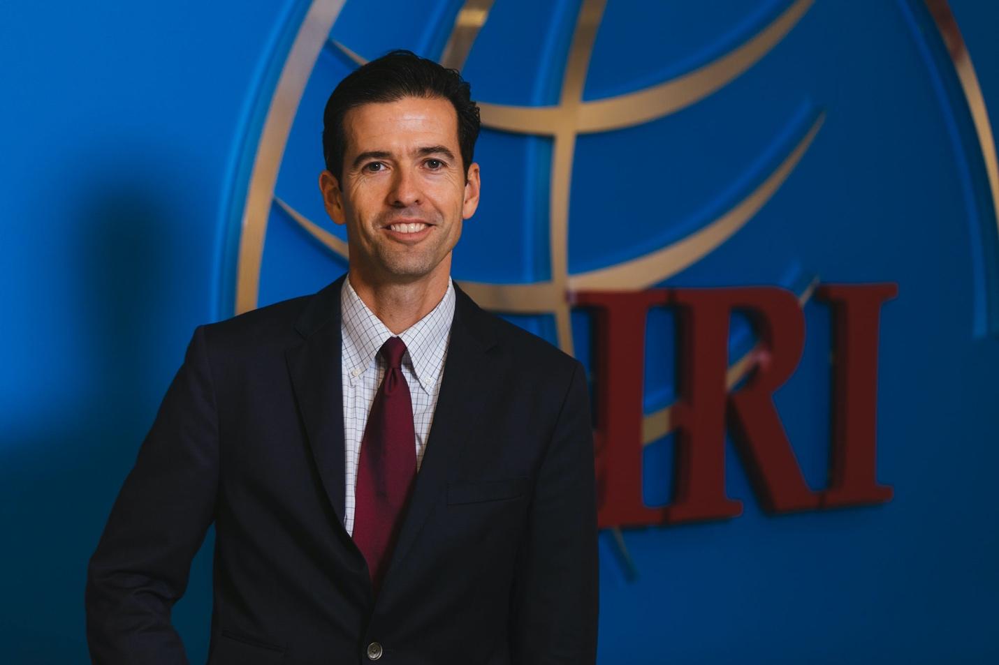 A person in a suit
Description automatically generated with low confidence
