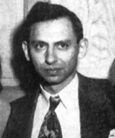A person in a suit

Description automatically generated with medium confidence