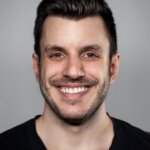 A person smiling for the camera

Description automatically generated with medium confidence