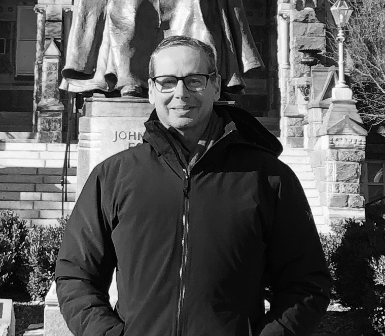 A person wearing glasses Description automatically generated with medium confidence