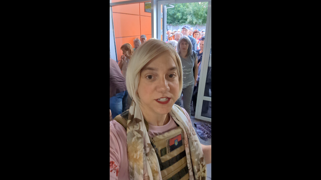 A picture containing person, indoor, window, staring

Description automatically generated
