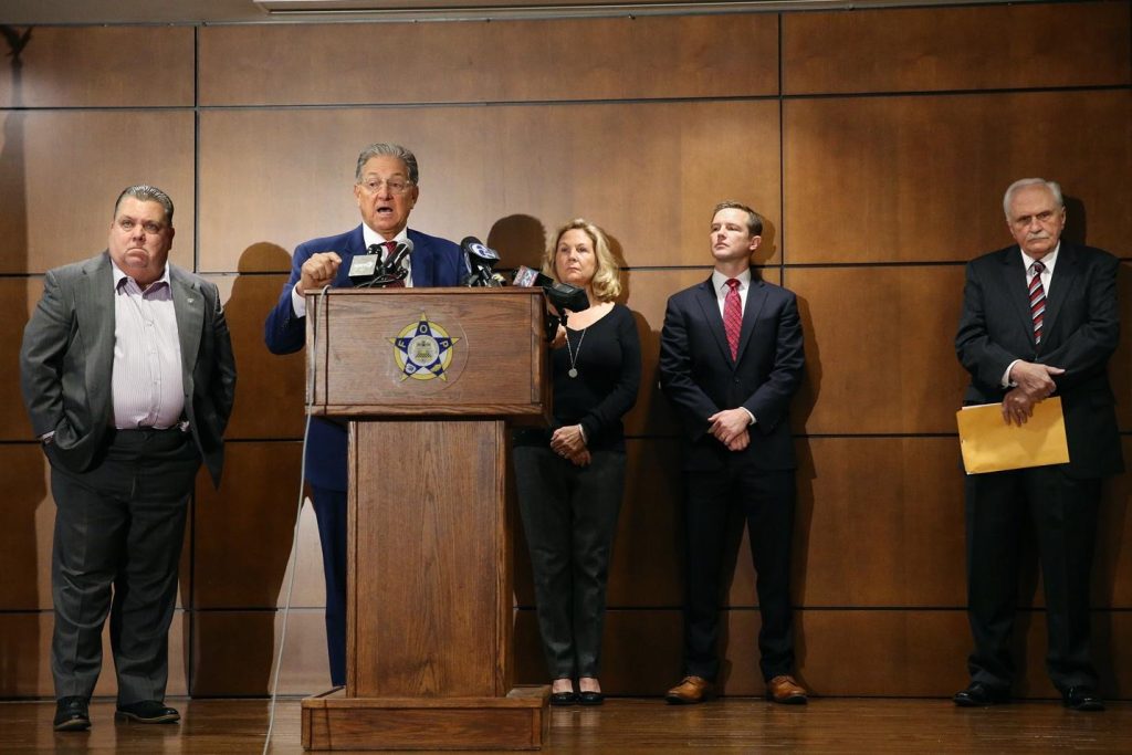 Attorney George Bochetto, second from left, speaks Tuesday about the petition he filed on behalf of Maureen Faulkner. At left is FOP President John McNesby. Standing next to Faulkner is Jack O'Neill, another attorney assisting her. At far right is Joseph McGill, who had been the prosecutor at Abu-Jamal's trial.