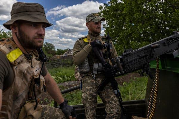 Ukrainian soldiers manning a checkpoint with a donated American .50-caliber machine gun near a village in the eastern region of Donetsk.