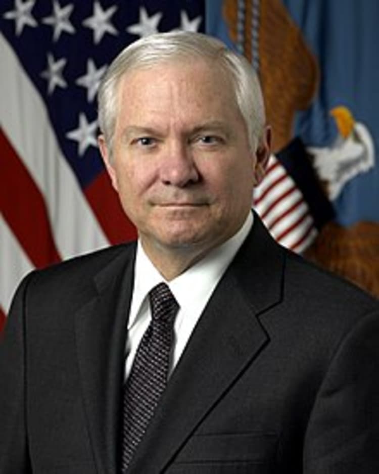 A person in a suit and tie Description automatically generated with medium confidence