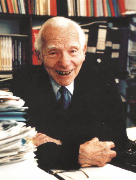 A person in a suit smiling

Description automatically generated with low confidence