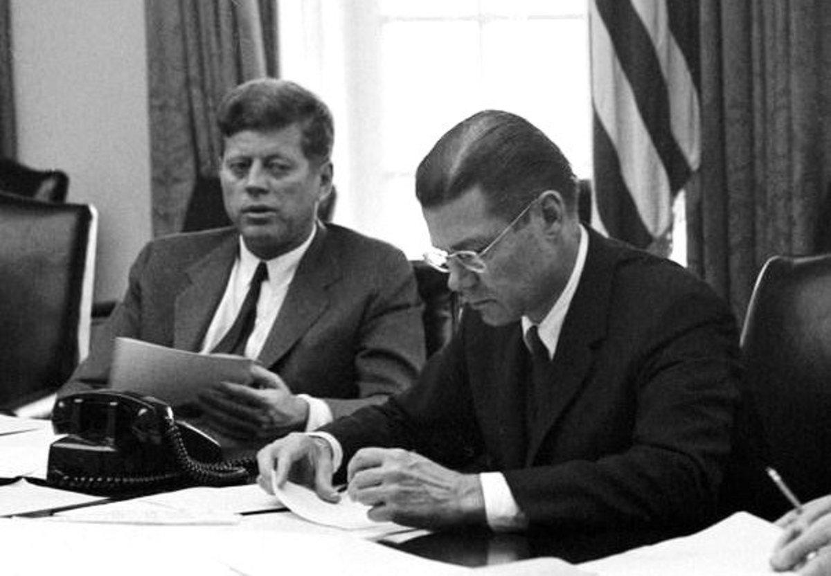President Kennedy and Robert McNamara hold a briefing on the Cuban Missile Crisis.
