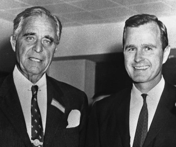 A couple of men in suits

Description automatically generated with low confidence