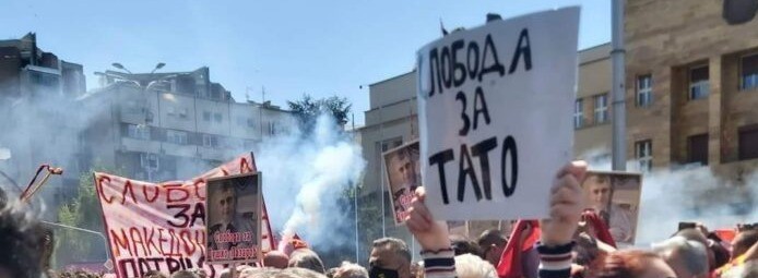 A group of people holding signs Description automatically generated with medium confidence