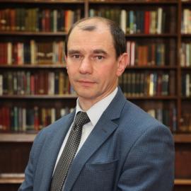 A person in a suit and tie

Description automatically generated with medium confidence