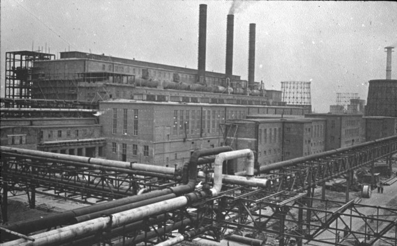 A picture containing factory, outdoor, building, black Description automatically generated