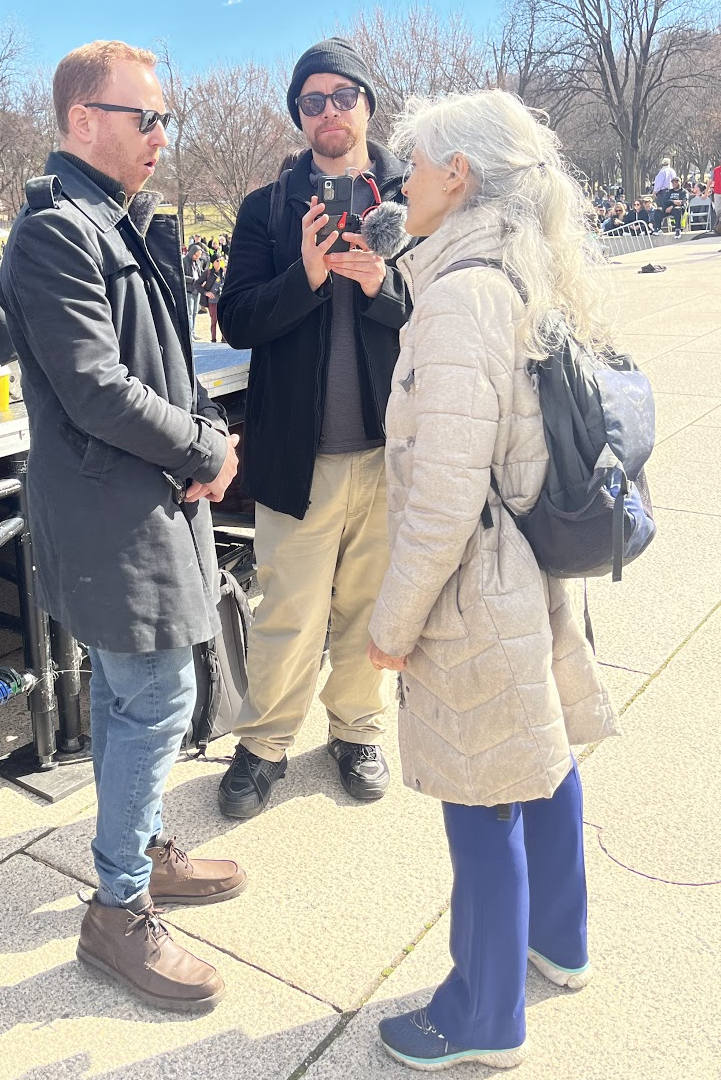 A group of people standing outside

Description automatically generated with low confidence