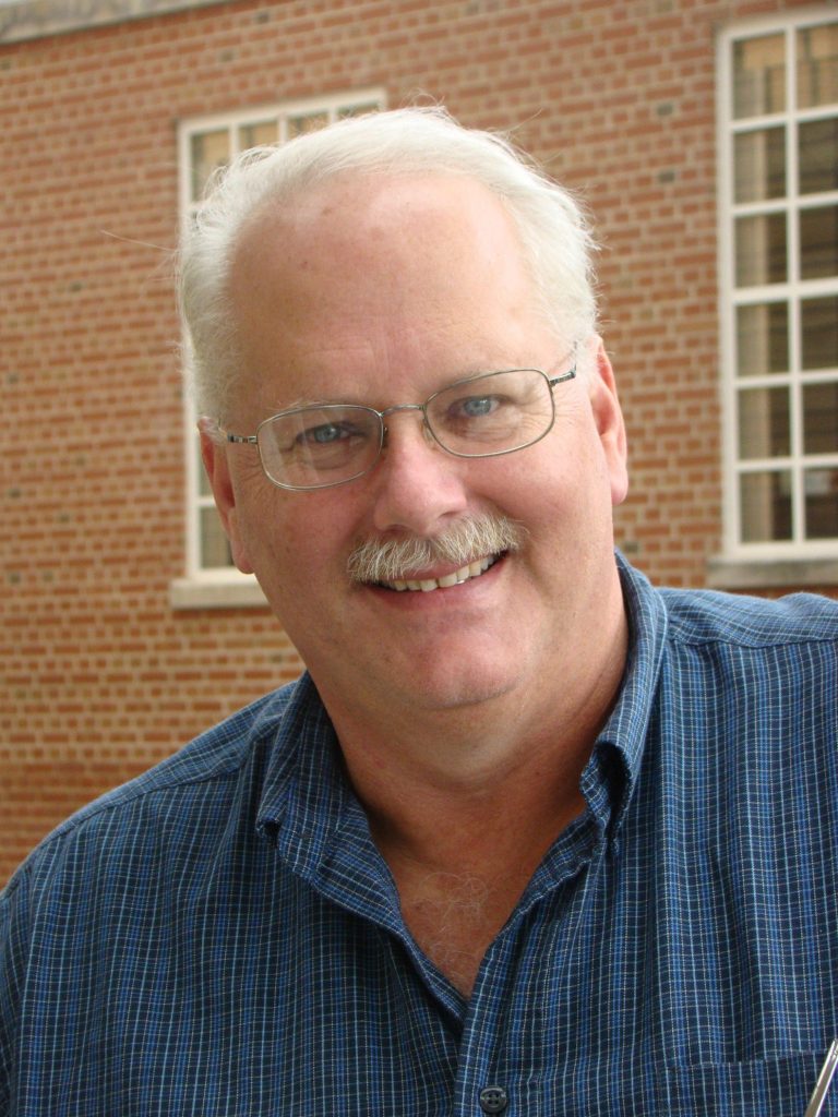 A picture containing person, building, person

Description automatically generated