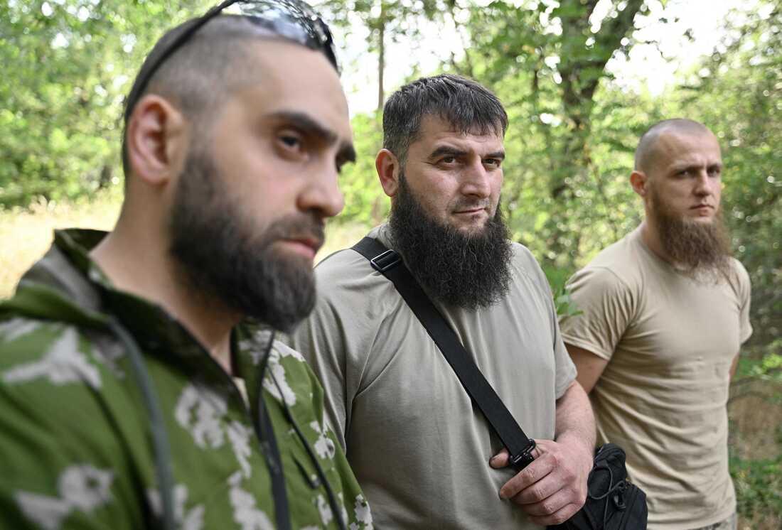 A group of men

Description automatically generated with low confidence