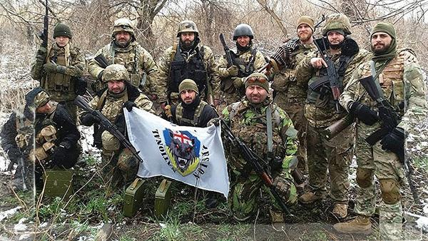 A group of soldiers holding a flag

Description automatically generated with medium confidence