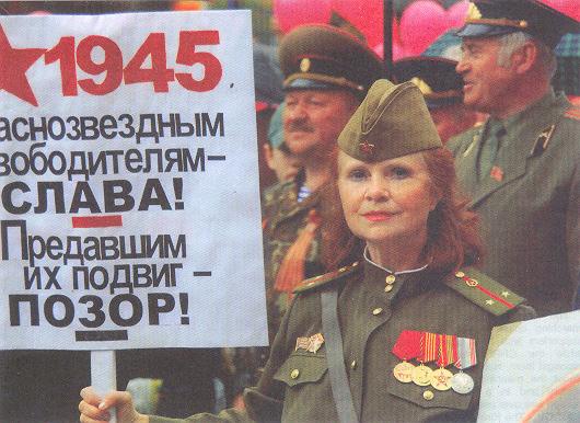 A person holding a sign

Description automatically generated with medium confidence