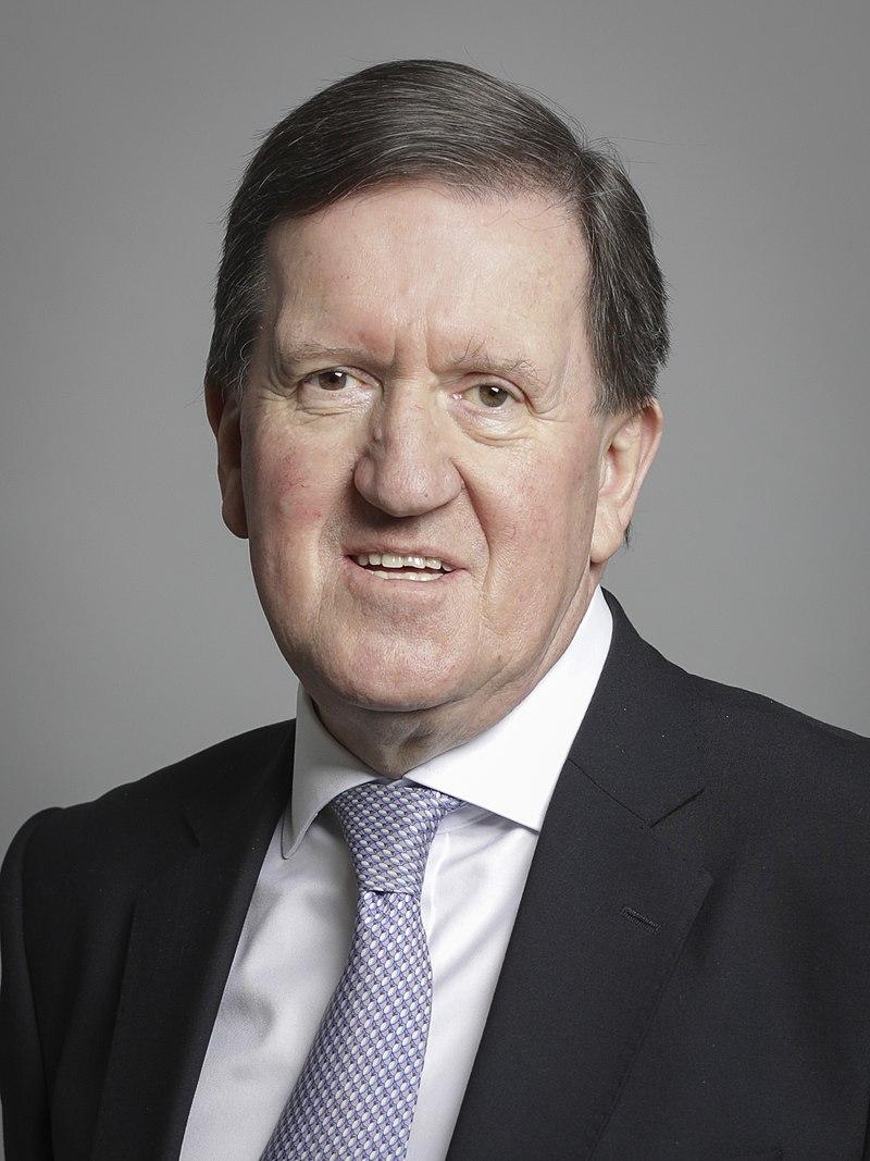 A person in a suit and tie

Description automatically generated with medium confidence