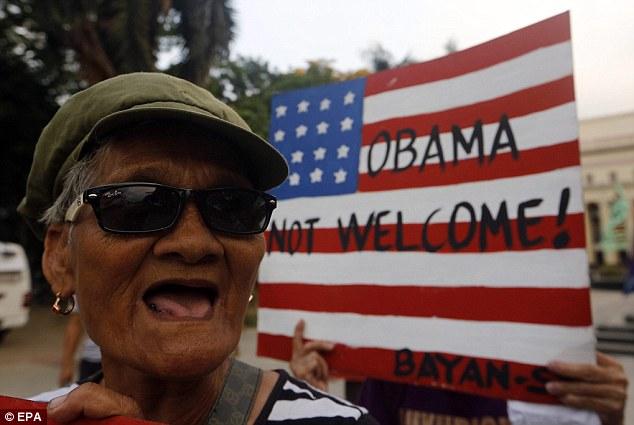 A Filipino protester shouts slogans during a protest rally against President Barack Obama's visit in Manila