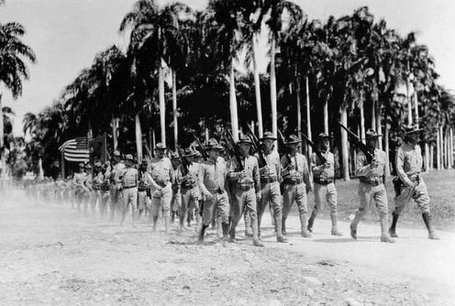 A group of soldiers marching

Description automatically generated with medium confidence