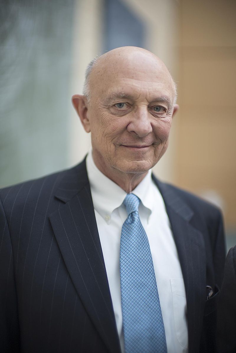 A person in a suit and tie

Description automatically generated with medium confidence
