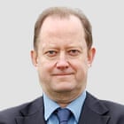 A person in a suit

Description automatically generated with low confidence
