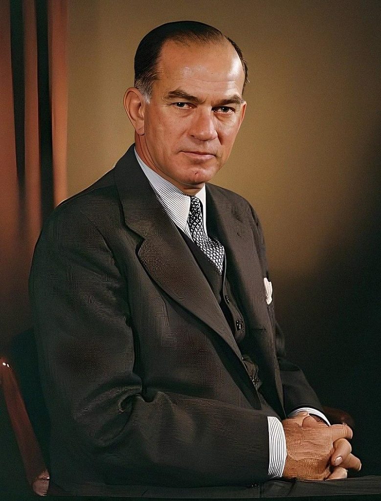 A person in a suit

Description automatically generated with medium confidence