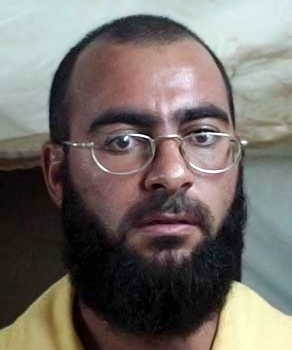A person with a beard and glasses Description automatically generated with medium confidence