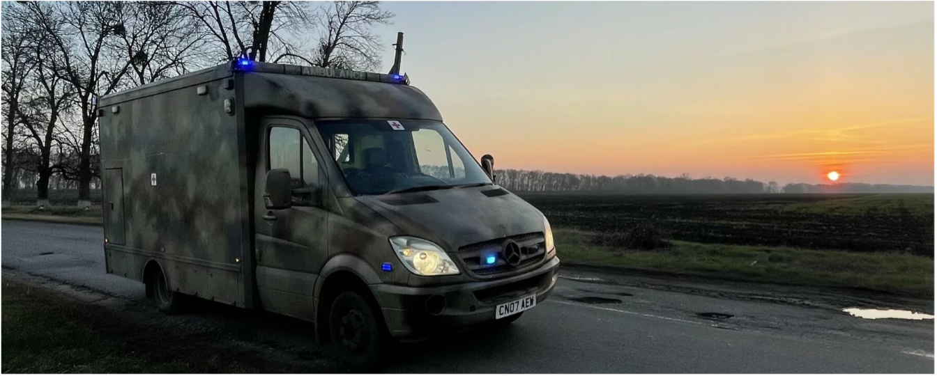 A picture containing outdoor, sky, car, road
Description automatically generated