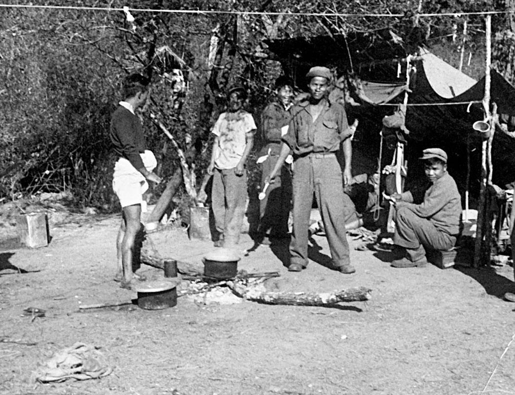 a group of people holding objects