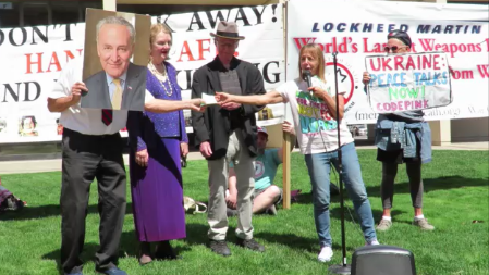 A group of people holding signs

Description automatically generated with low confidence