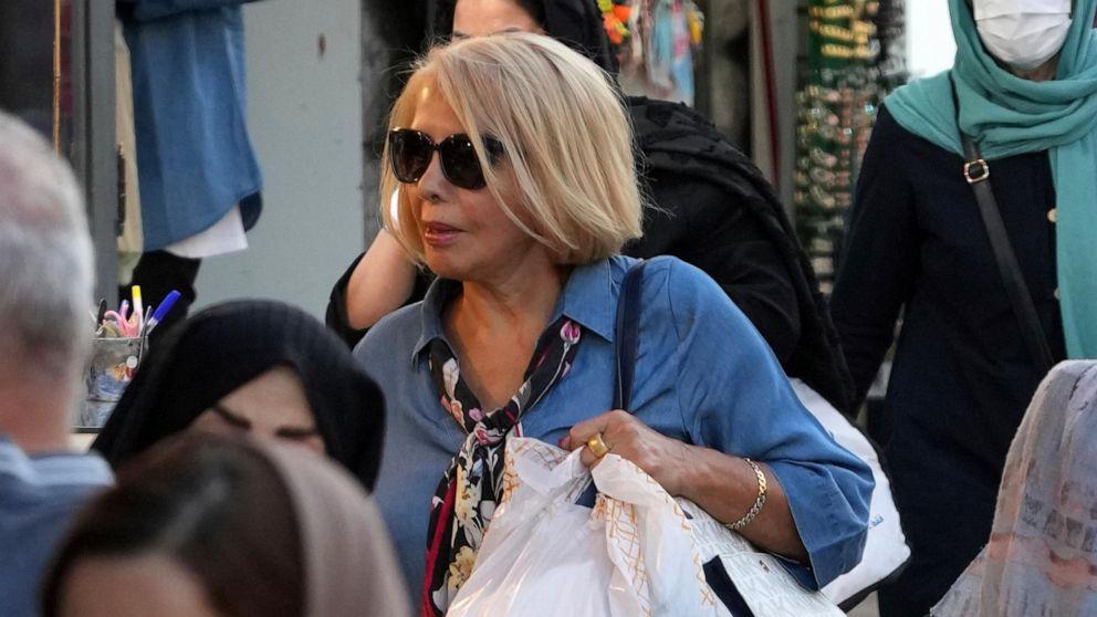 A person carrying a white bag

Description automatically generated with low confidence