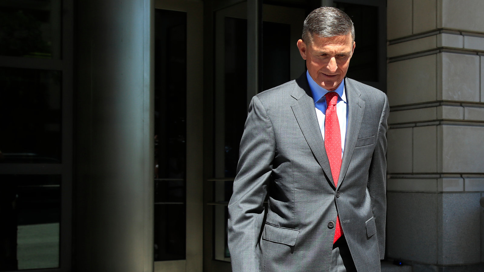 A person in a suit and tie walking

Description automatically generated with medium confidence