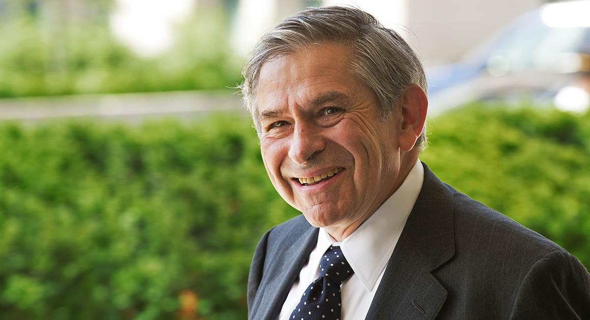 A person in a suit smiling
Description automatically generated with medium confidence