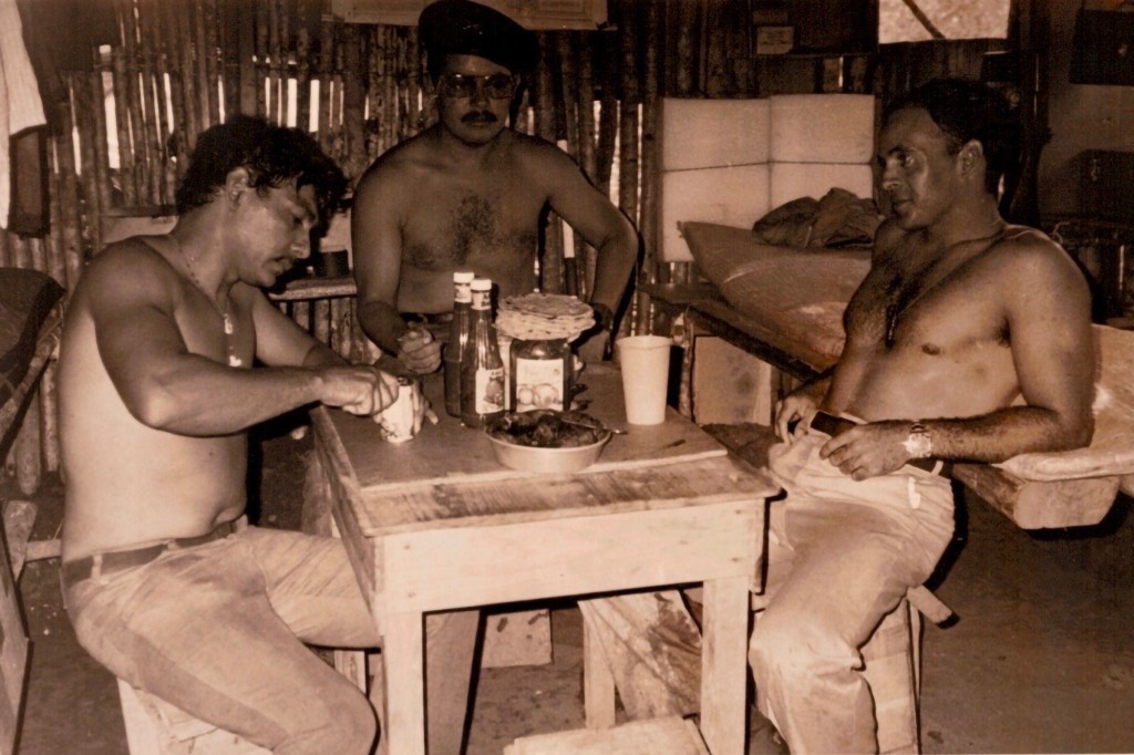 Dinner in one of the Miskito camps, Prado on the right, where living conditions were primitive at best.
